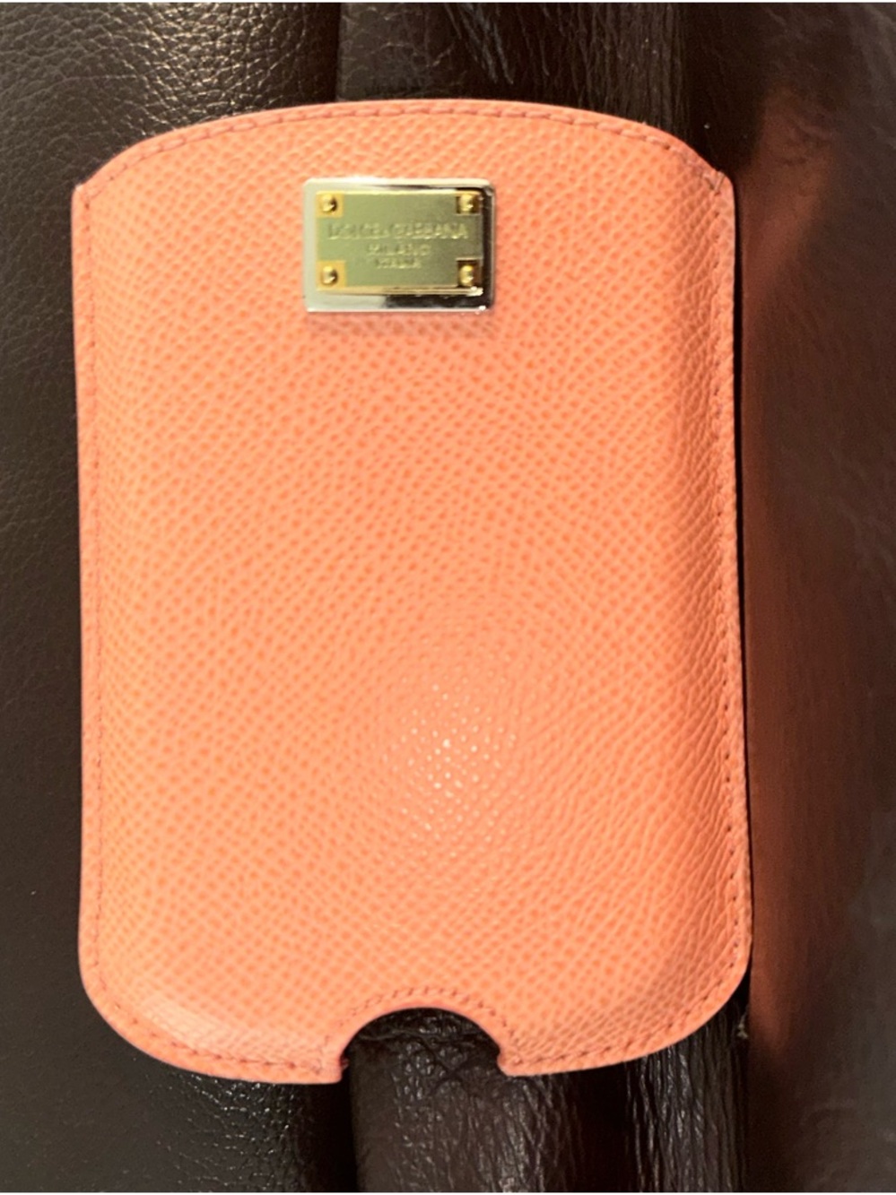 Dolce & Gabbana Coral Pink Textured Leather Sleeve with Gold Plaque. New